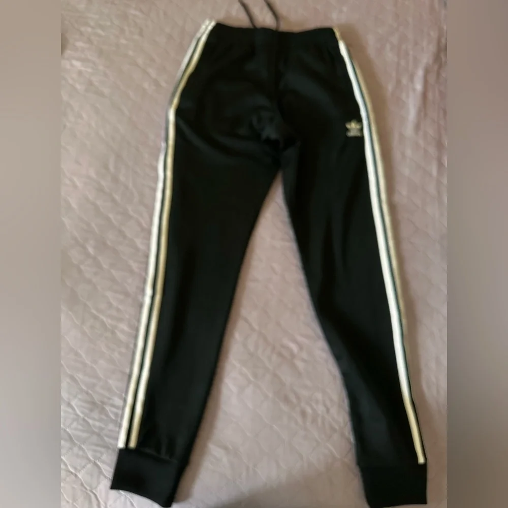 Black adidas track pants with white stripes - Picture 2 of 2